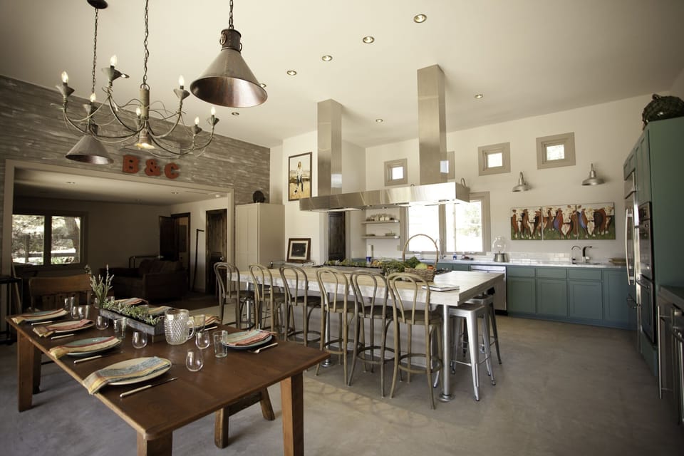 Two 4-burner Gaggenau cooktops, 2 dishwashers, two sinks, and plentiful seating
