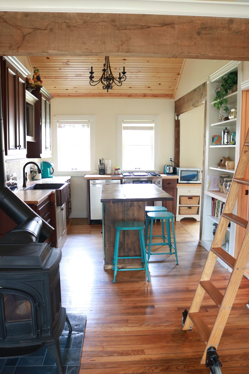 Kitchen view from dining room.  Reclaimed rolling library ladder.   
