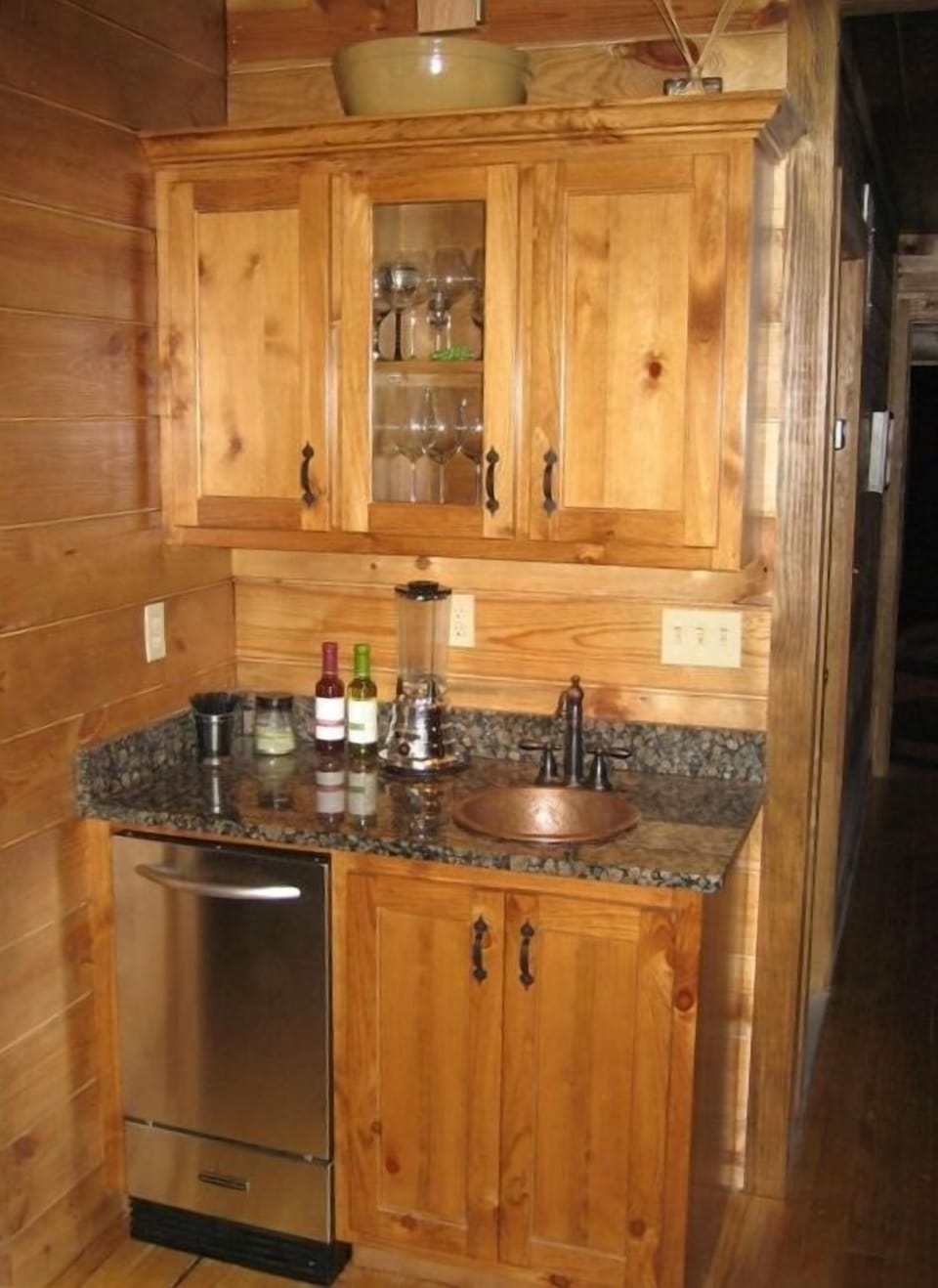 Wet bar in Den with ice maker