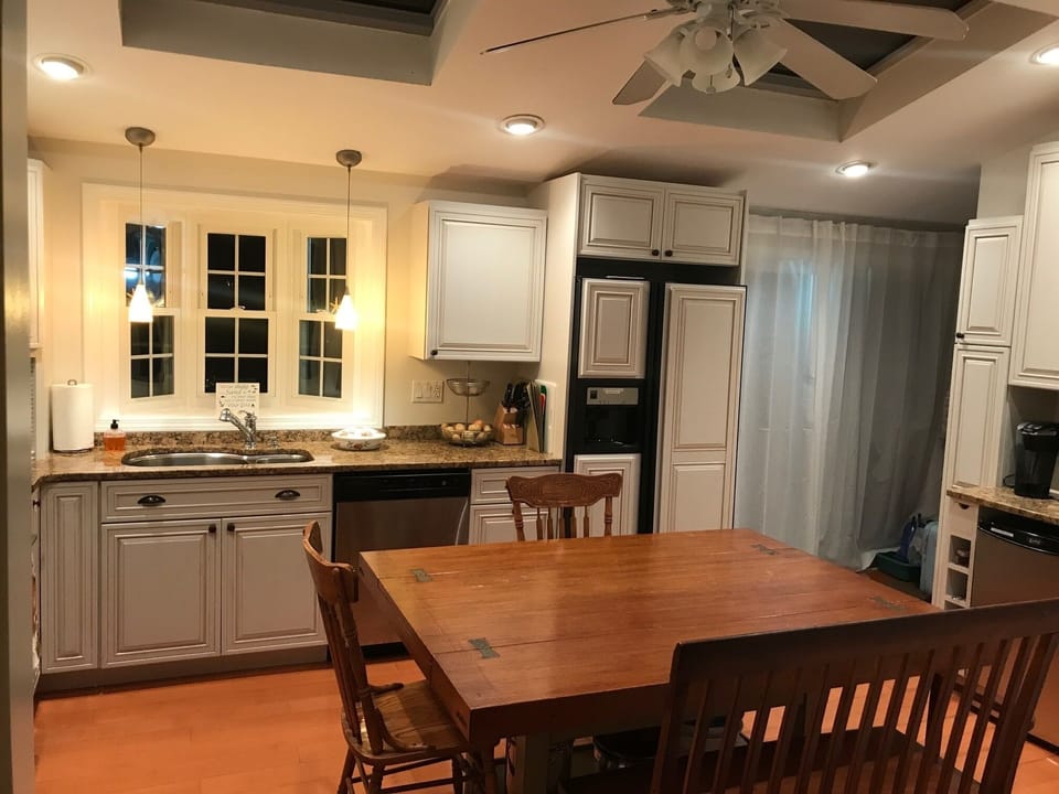 The kitchen island unfolds into a large dining table.  Seats 6-8 comfortably.