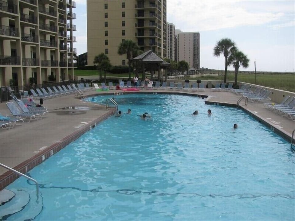 Large outdoor pool with kiddie pool.
Gazebo's with barbeque grills by pool side
