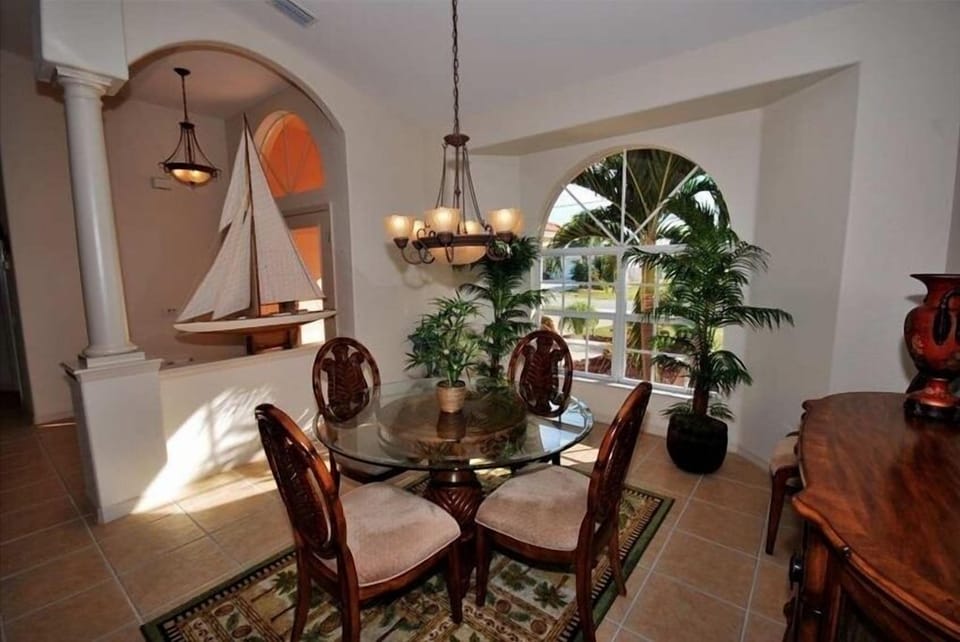 Elegance and charm. View of dining room and front entrance.