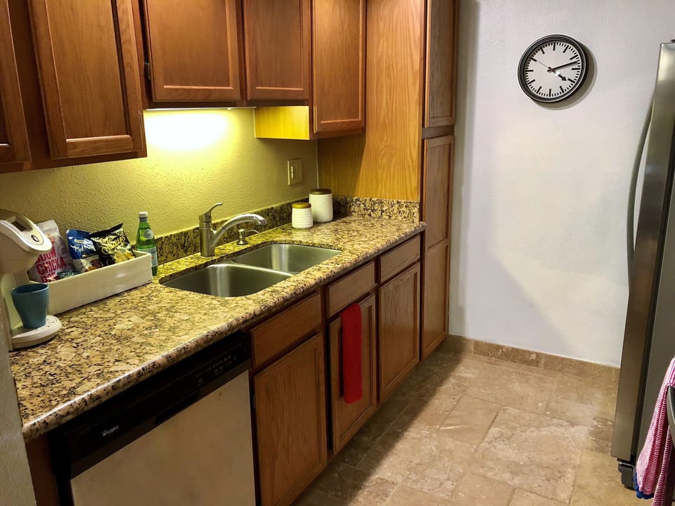Kitchen with new appliances and keurig.
