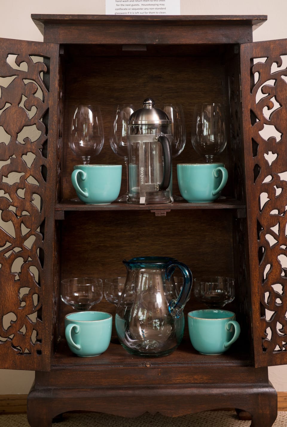 The accent chest is filled with glassware for our guests