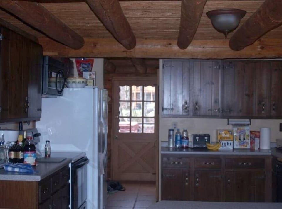 Other side of kitchen - facing appliances and towards back deck entrance door