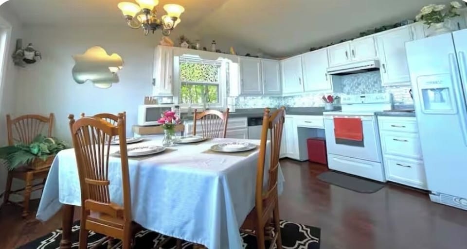 Open concept, dining, kitchen, and living room with Lake views