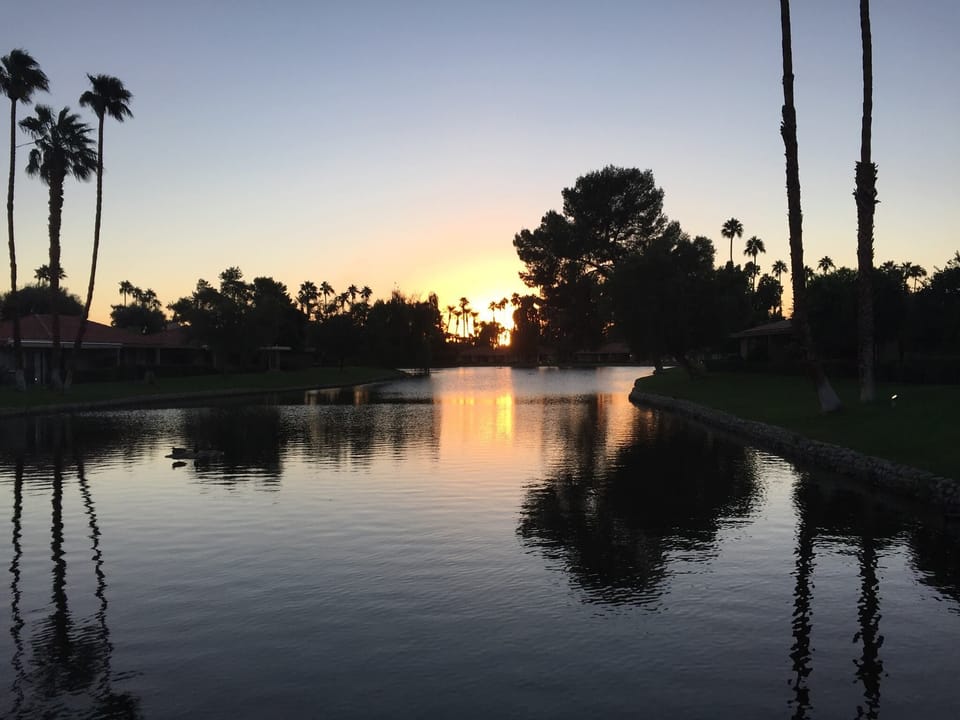 Sunrise over the pond outside of condo