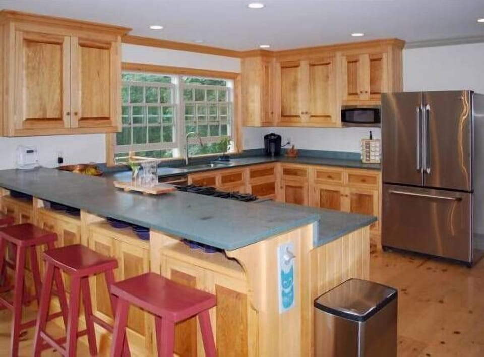 Kitchen with seating for 4 at counter plus table for 6