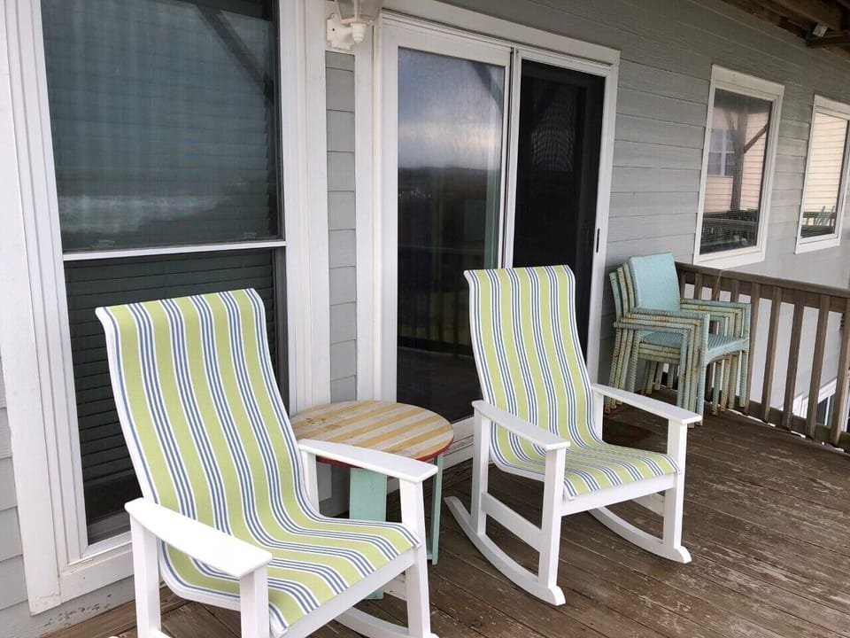 Covered deck on 2nd floor with access from master bedroom and hall