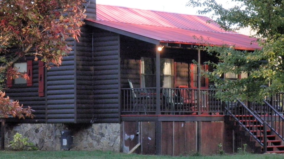 Back view of cabin at sunset