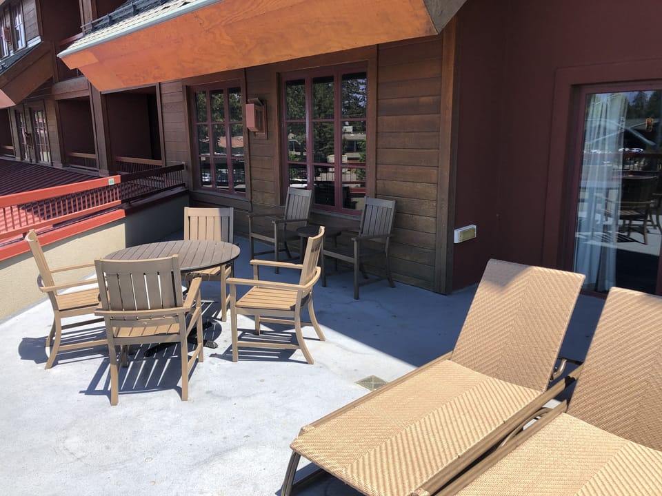 Large outdoor deck with furniture.
