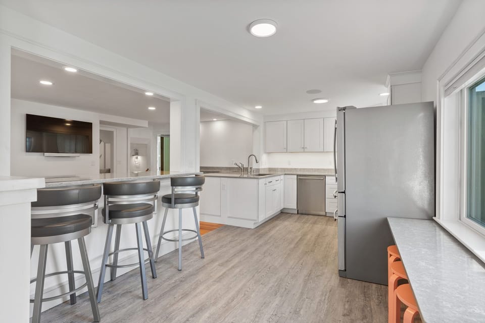 open kitchen/dining area, quartz counters, plus new low kiddos table & stools!