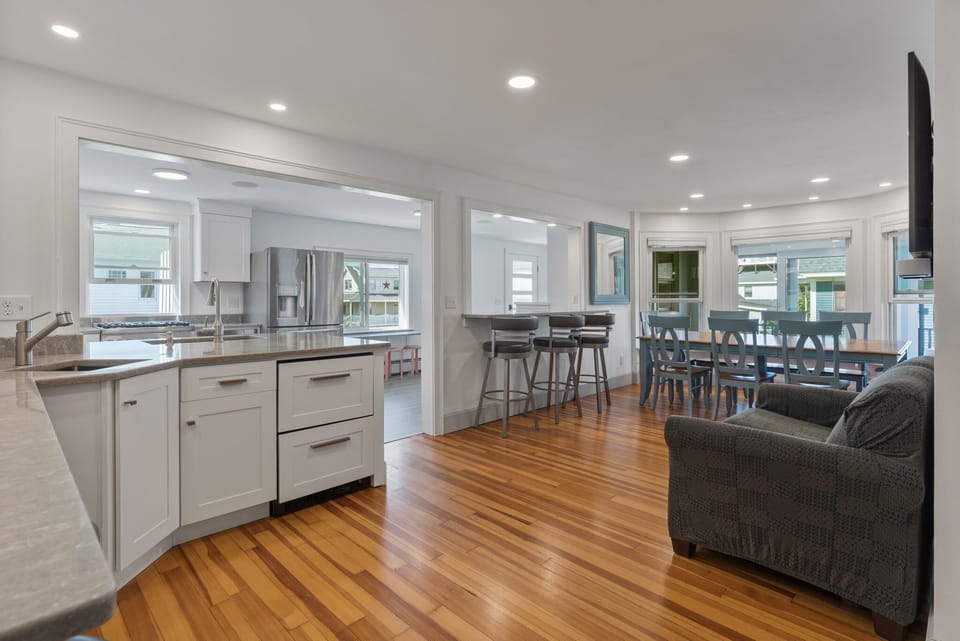 open kitchen/layout with lots of counter space, wet bar, and seating options