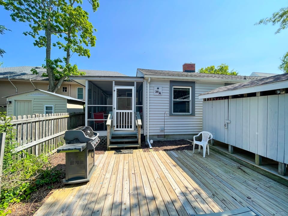 Outdoor area with a private grill, outdoor shower.