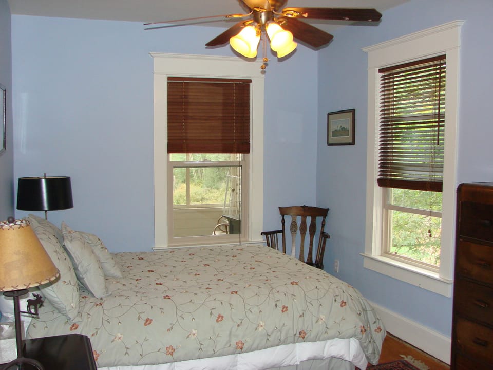 2nd Story "Blue Room" with ceiling fan, now has sleigh bed in it.