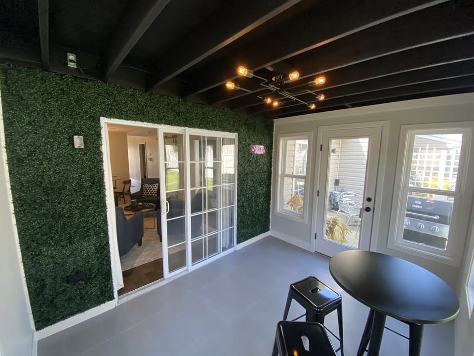 Sun room with door to rear patio