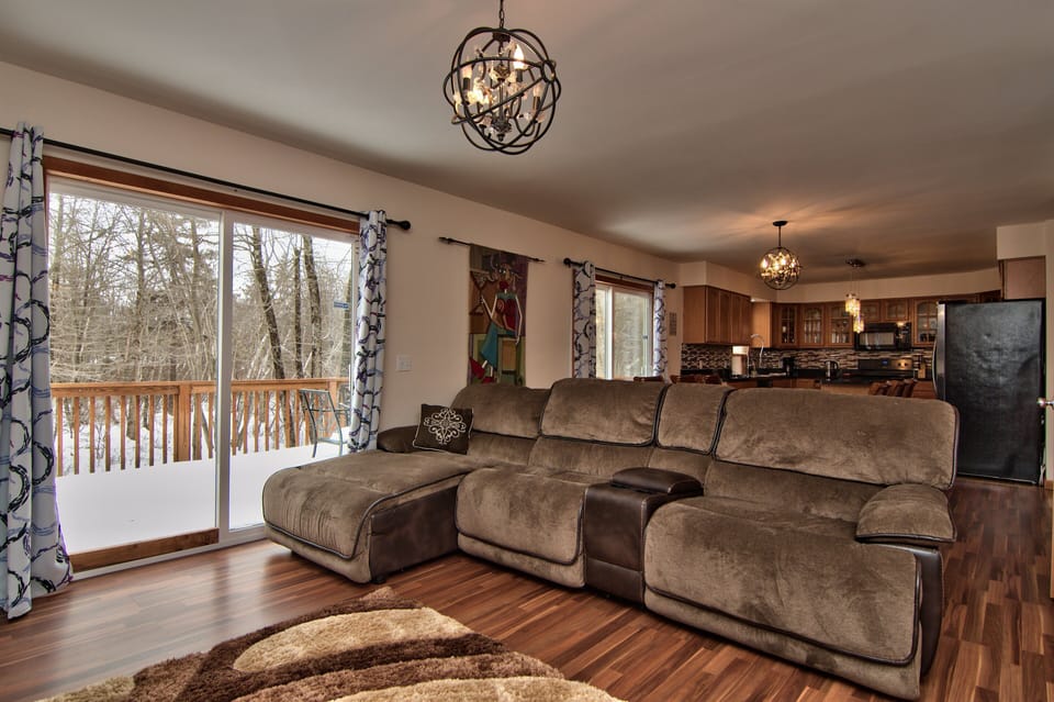 Open floor layout w/ dining room, kitchen, fireplace room, and game room 