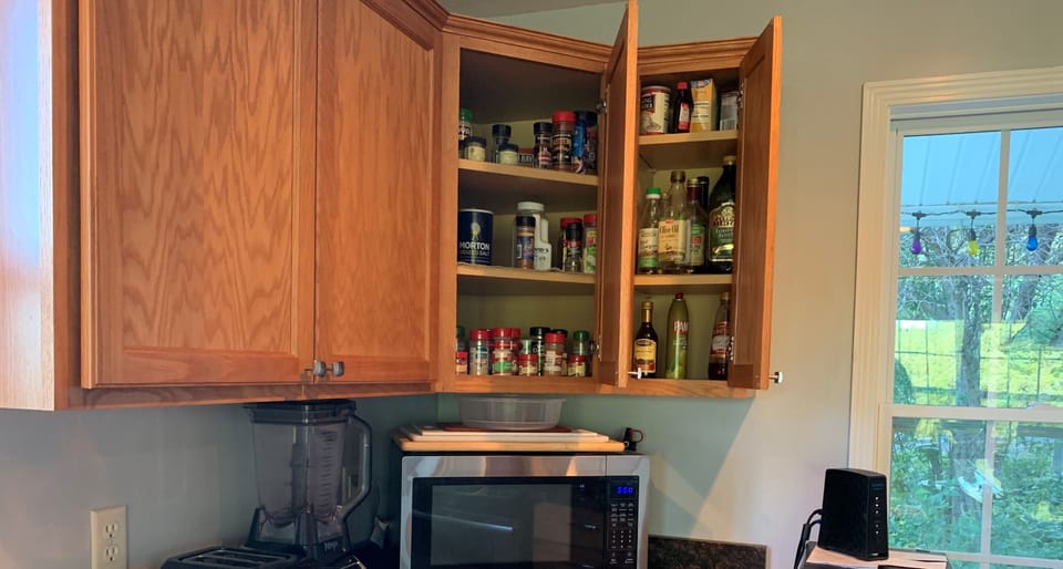 Our spices cupboard with vinegars and oils will make your packing a breeze!

