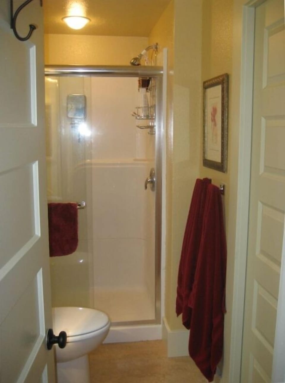 Full bath off queen master with pocket door to 1/2 bath