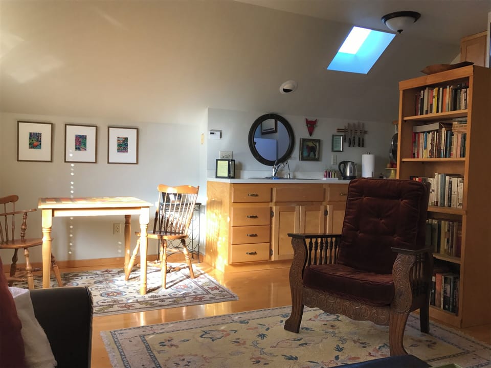 Dining and kitchen area.  Open floor plan.  Bright and sunny.  Original artwork.