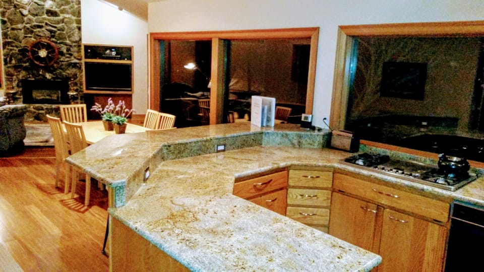 view from Kitchen to the living room fireplace and entertainment center