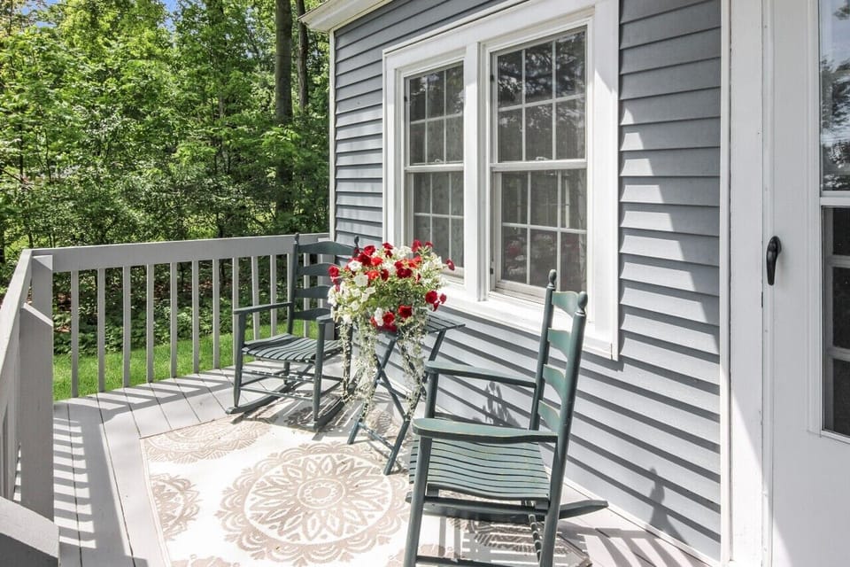 Sit on the porch and enjoy West Bay views or enjoy the backyard with forest.