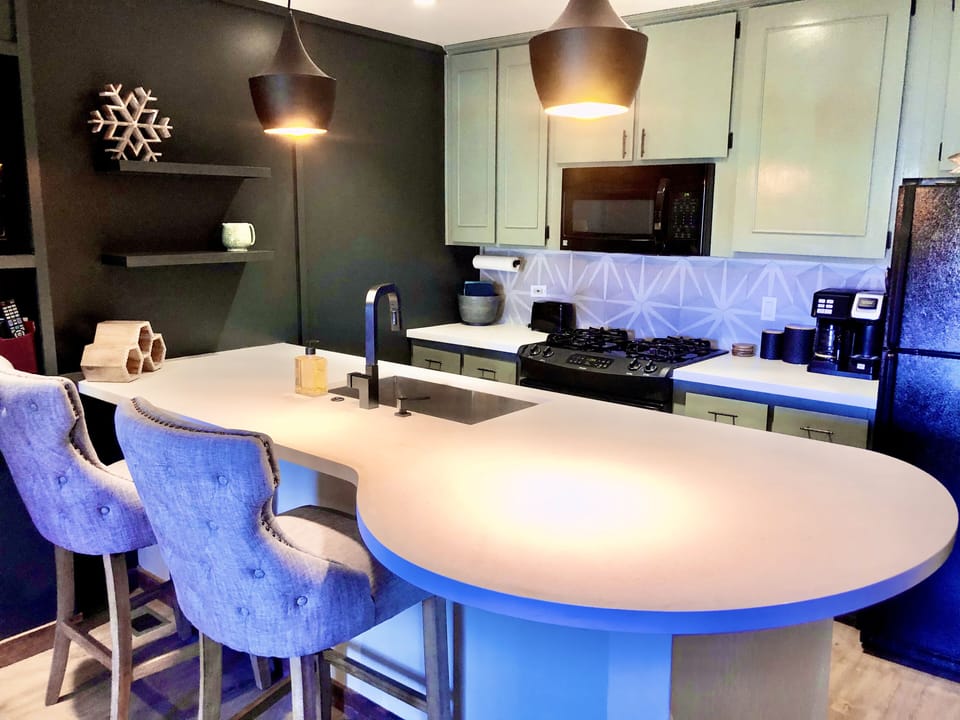 Clean white quartz countertops in this updated kitchen