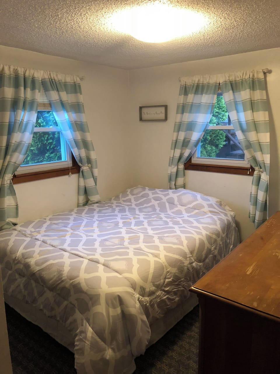 Bedroom in back of house - queen size bed.  Stackable washer/dryer in closet.