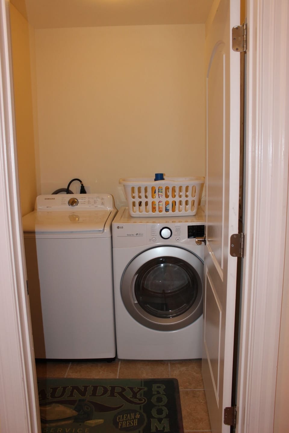 Laundry room with full size washer and dryer.
