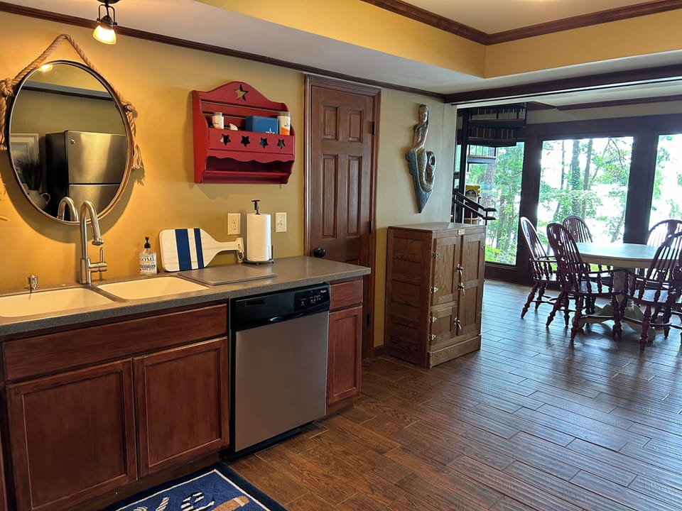 Terrace level kitchen with sink/dishwasher/full size refrigerator/dining area