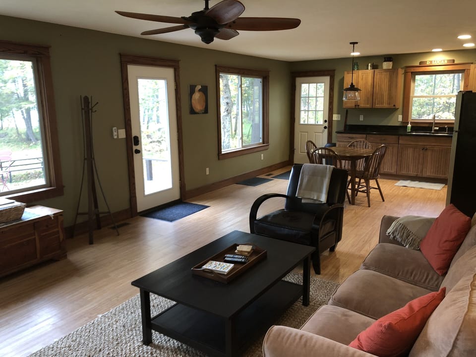 Living and kitchen space.  All windows face the lake where the moon rises.