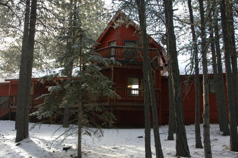 Angel Fire, NM Vacation Home during the winter. Back Yard view