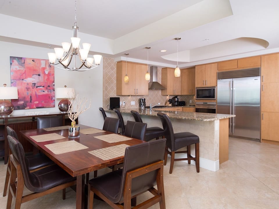 Dining table comfortably seats 6 with bar seating for 4; perfect for the kiddos!