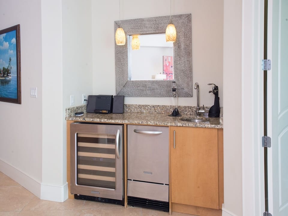 Wet bar boasts commercial-grade ice maker and wine fridge
