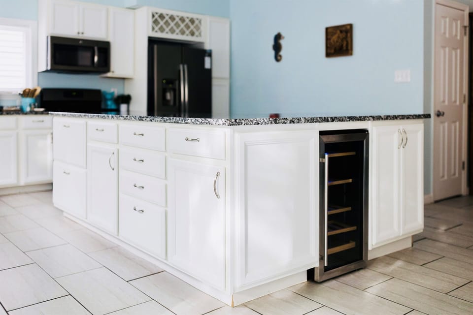 Fully Stocked Kitchen | Main Floor | Open Concept | Granite Countertops | Stainless Steel Appliances | Wine Fridge | Large Island with Seating for 4