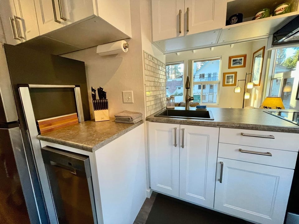 Convenient ladder tucked away to reach high cabinets.