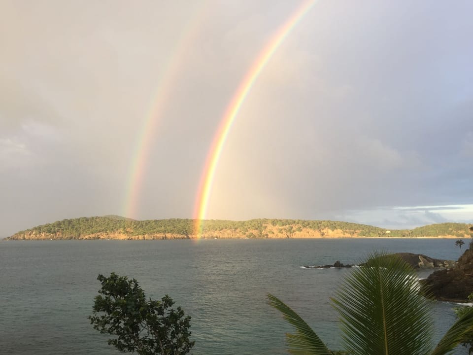Beautiful twin rainbows taken by a guest, from deck toward Inner Brass Island.