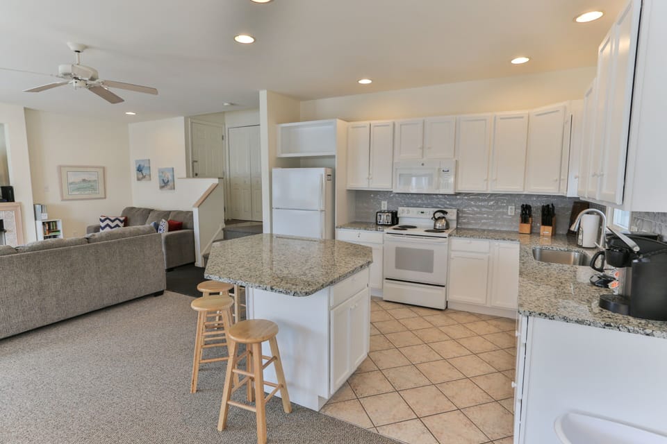 Convenient island. Perfect to put out snacks & appetizers. Storage underneath