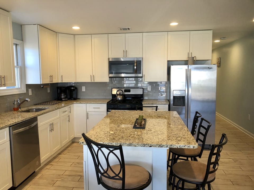 close up of kitchen which includes a beverage cooler along with other appliances