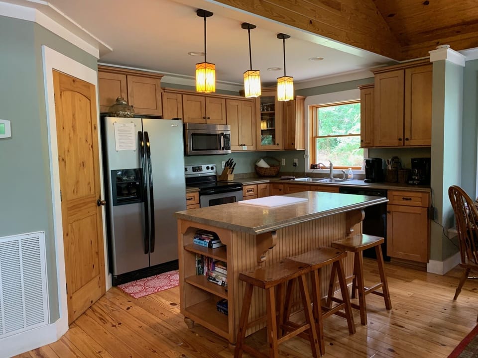 Well stocked and organized Kitchen.
Dining area and main living area open.