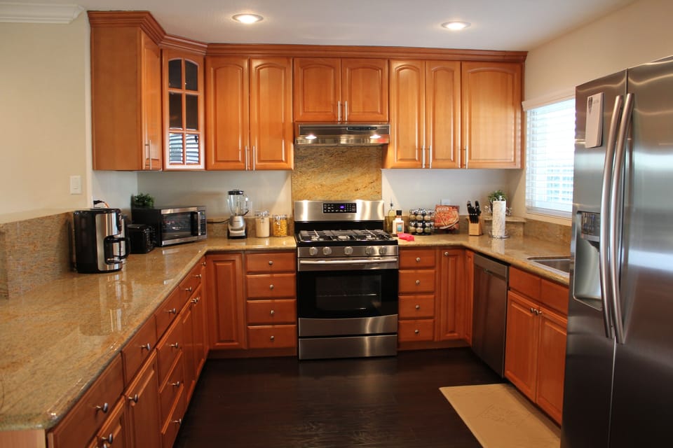 Full kitchen with Keurig coffee maker and drip pot