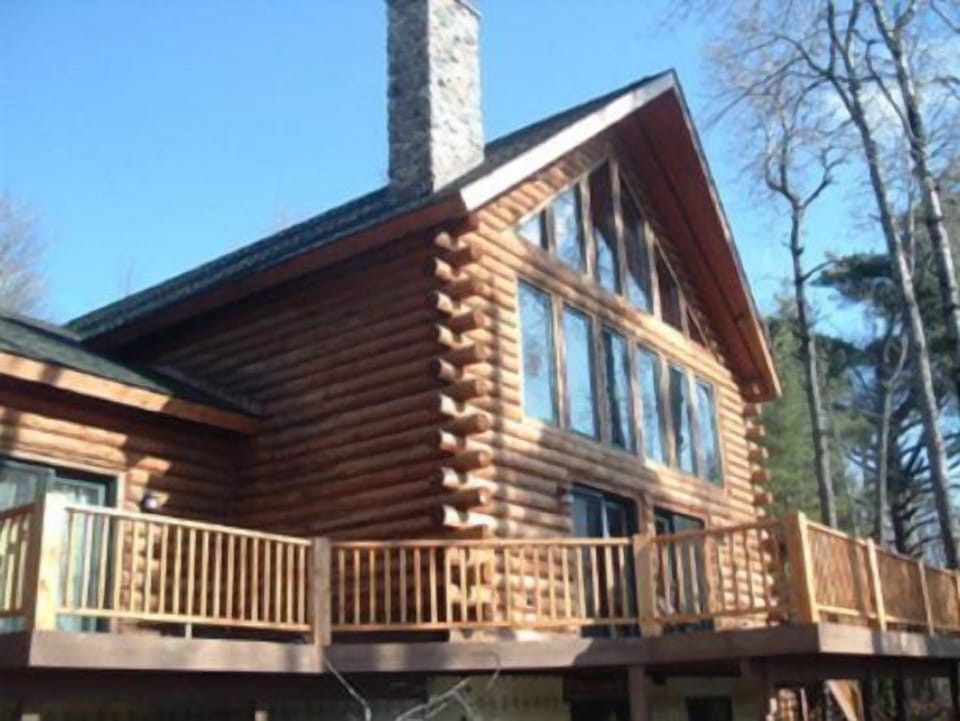 Pond side of house with wrap around decks