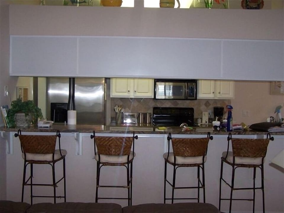 Kitchen with granite countertop, Stainless Steel Appliances and marble splash