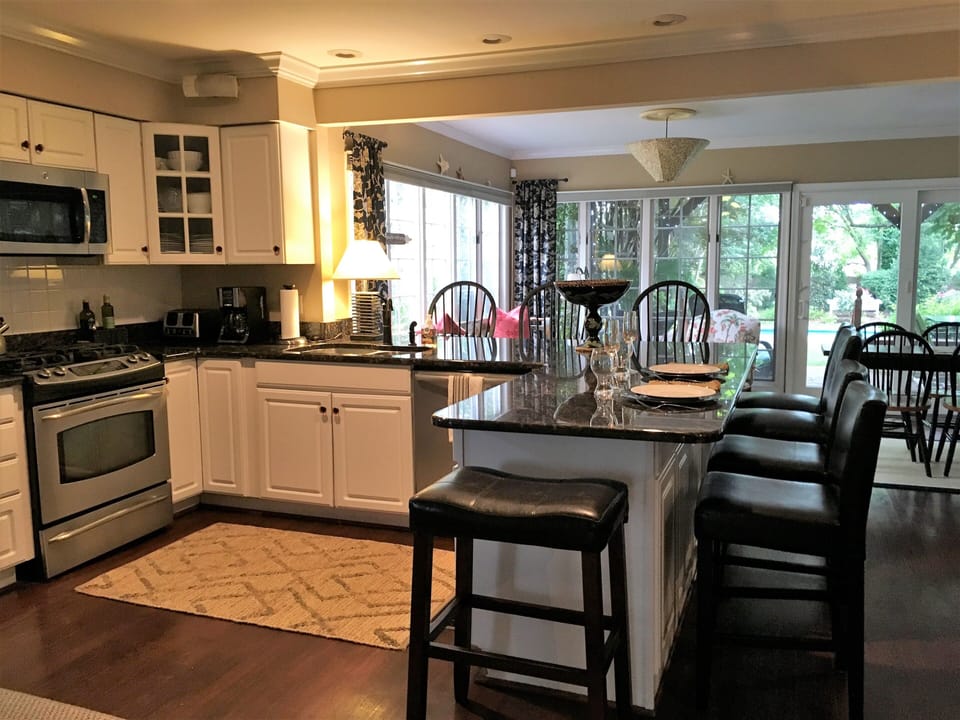 Kitchen looking through to sitting area around Island