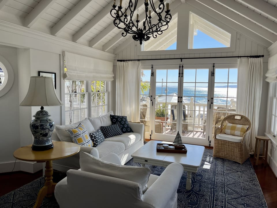Living Room with view of the pier and panoramic vistas.