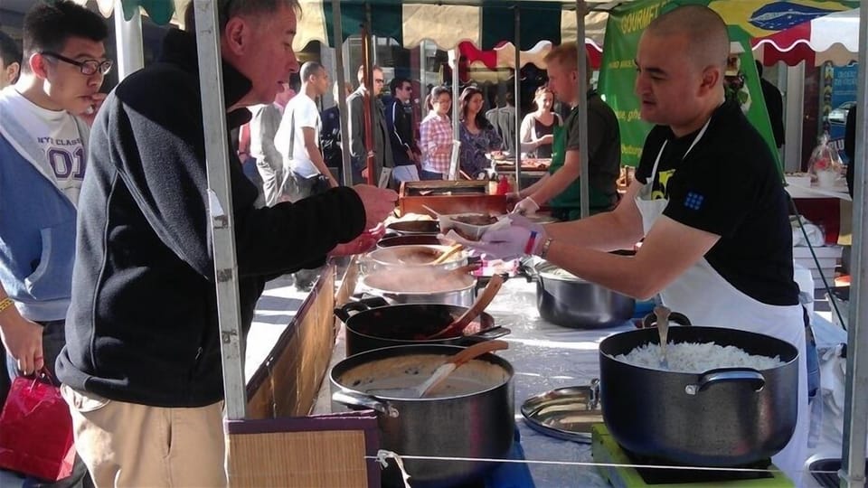 Choosing a Portuguese stew at the farmers market!