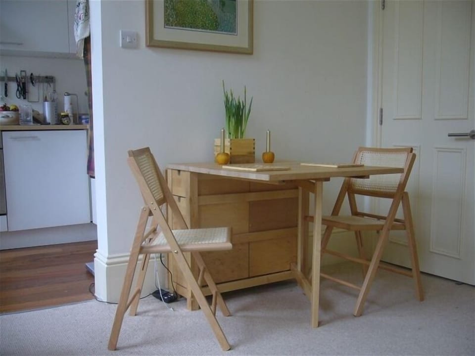 Dinning table opens to seat two or four