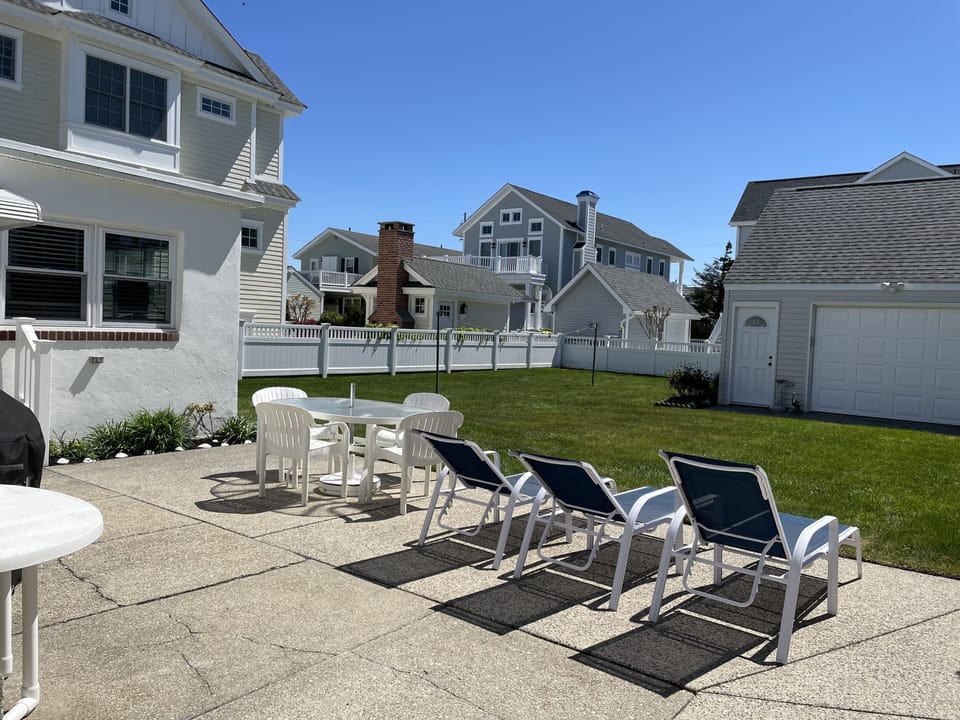 Large grass back yard, Clothes line and  garage with extra beach suppies. 