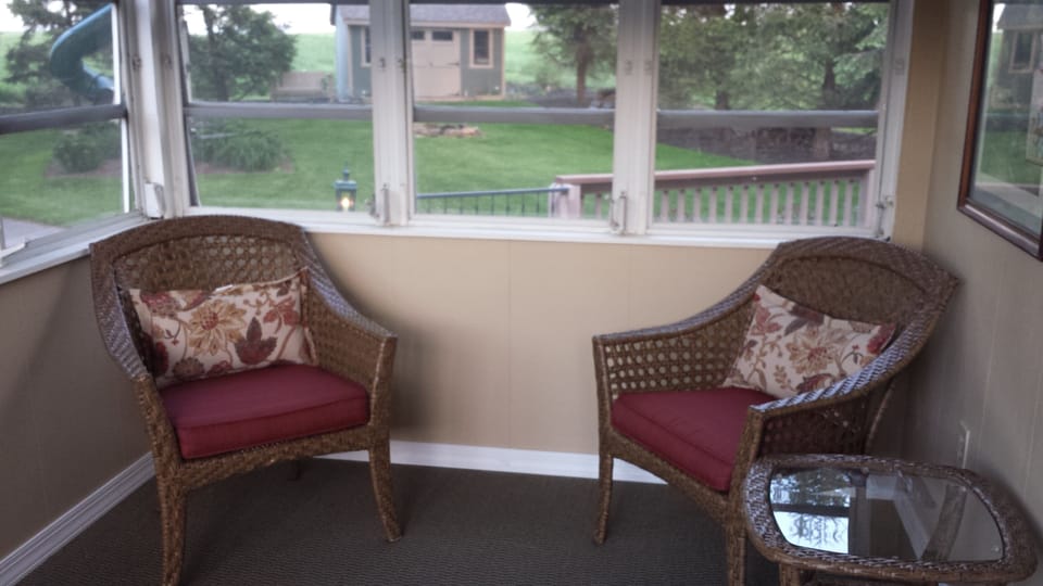 Relax in the enclosed sun porch.