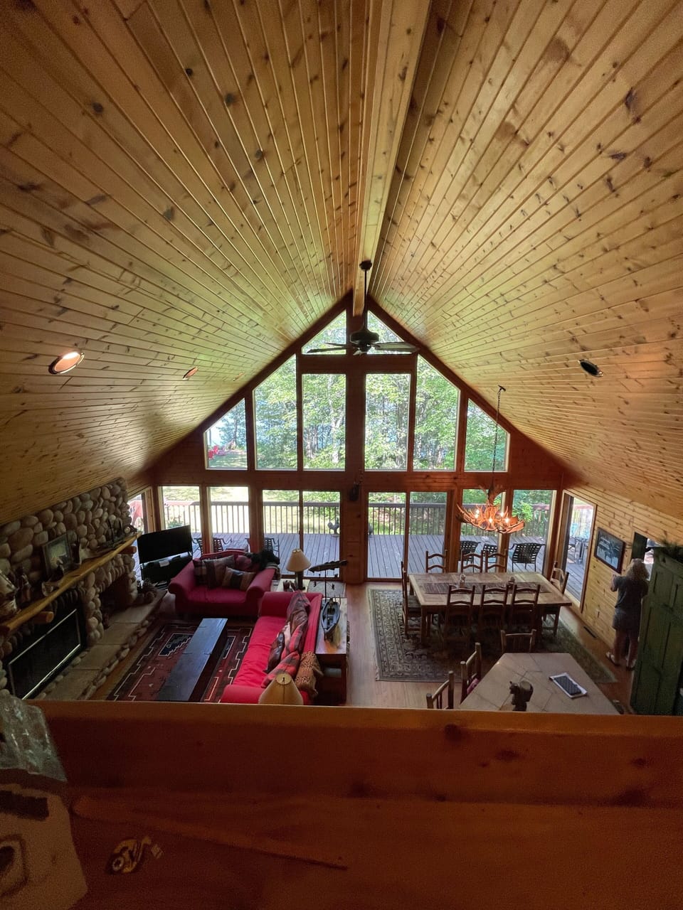 Main floor wood fireplace, tv and seating, dining and kitchen with large island